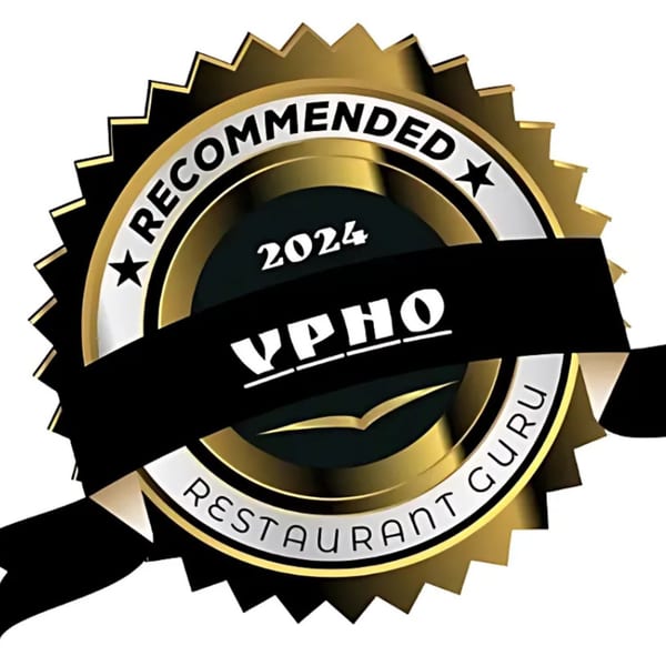 Gold and black 'Recommended 2024 vPho Restaurant Guru' award seal with stars.