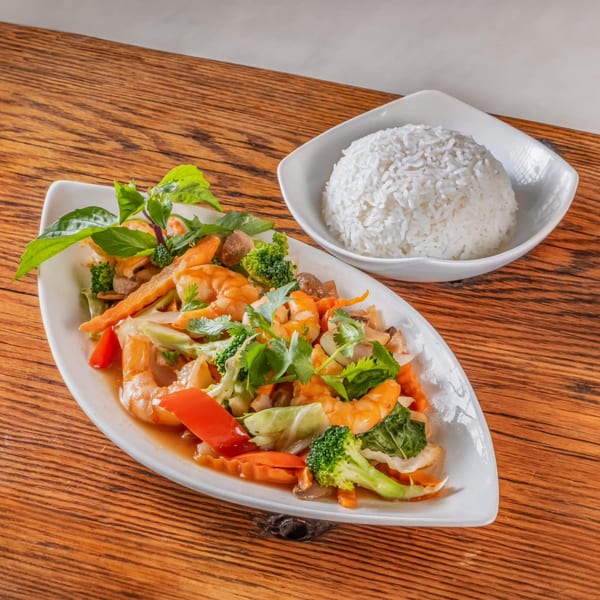 vPho's shrimp stir-fry with broccoli, carrots, and basil, served with a side of white rice.