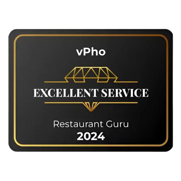 vPho Restaurant Guru 2024 "Excellent Service" award, a black plaque with gold trim and lettering.