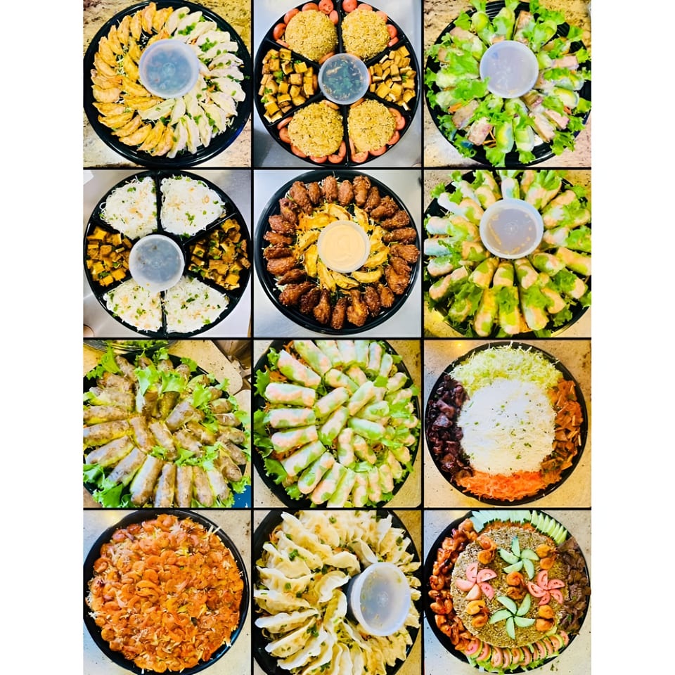 A grid of twelve round platters filled with various Vietnamese dishes, including dumplings, spring rolls, and rice.